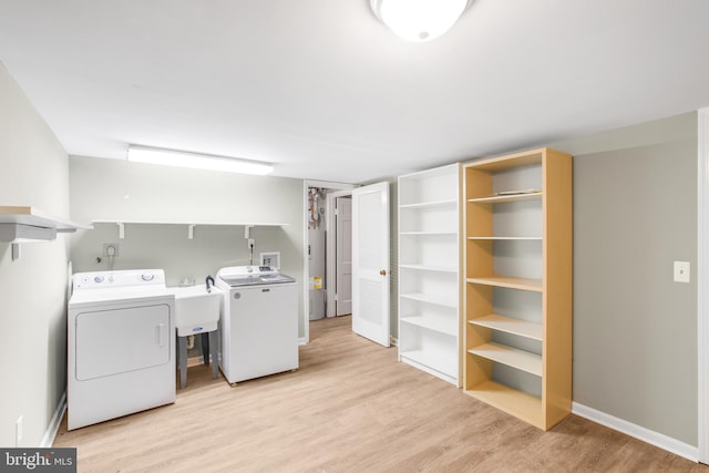 8007 Lewinsville Rd, Mclean, VA 22102 - washroom with washer and dryer, light wood-style floors, and baseboards