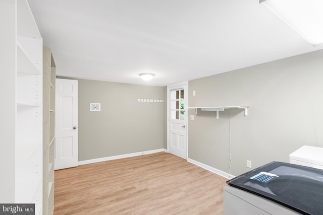 8007 Lewinsville Rd, Mclean, VA 22102 - laundry area with light wood finished floors and baseboards