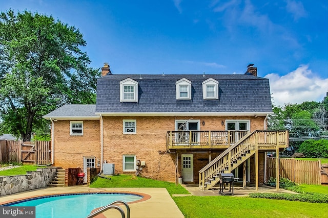 8007 Lewinsville Rd, Mclean, VA 22102 - rear view of property featuring a chimney, stairs, a deck, and brick siding