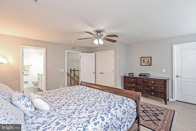 15255 Leicestershire St, Woodbridge, VA 22191 - bedroom with a closet, light wood-type flooring, connected bathroom, a ceiling fan, and baseboards