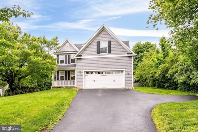 255 Summit Ave, Conshohocken, PA 19428 - traditional home with driveway, a front lawn, and a garage