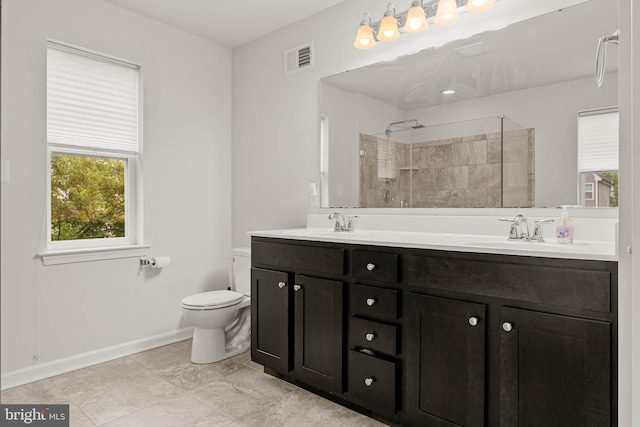 255 Summit Ave, Conshohocken, PA 19428 - full bath with double vanity, toilet, a tile shower, and baseboards