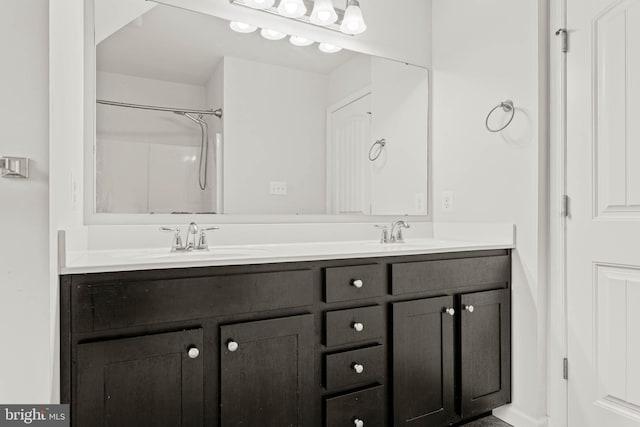 255 Summit Ave, Conshohocken, PA 19428 - bathroom featuring double vanity, a shower, and baseboards