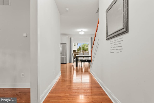 255 Summit Ave, Conshohocken, PA 19428 - hall with light wood-type flooring, baseboards, and stairway