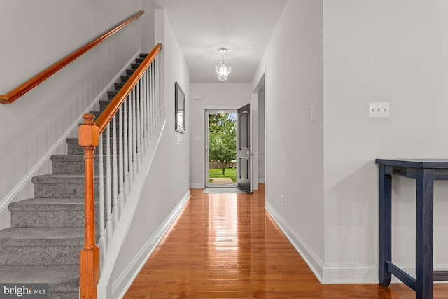 255 Summit Ave, Conshohocken, PA 19428 - entrance foyer with wood finished floors, a chandelier, stairs, and baseboards