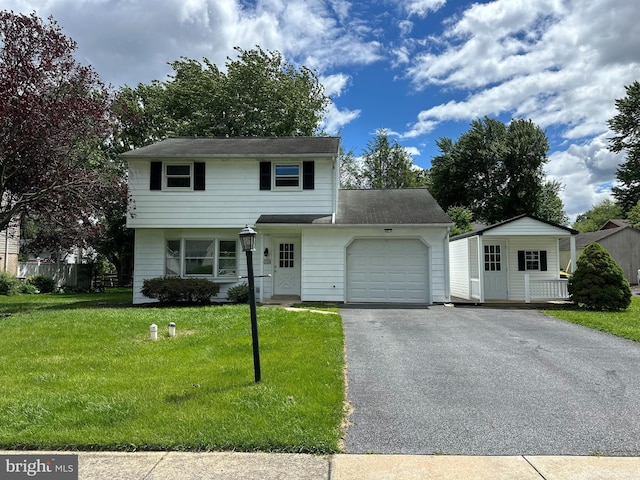 426 Parkwynne Rd, Lancaster, PA 17601 - view of front of house with an attached garage, driveway, and a front yard