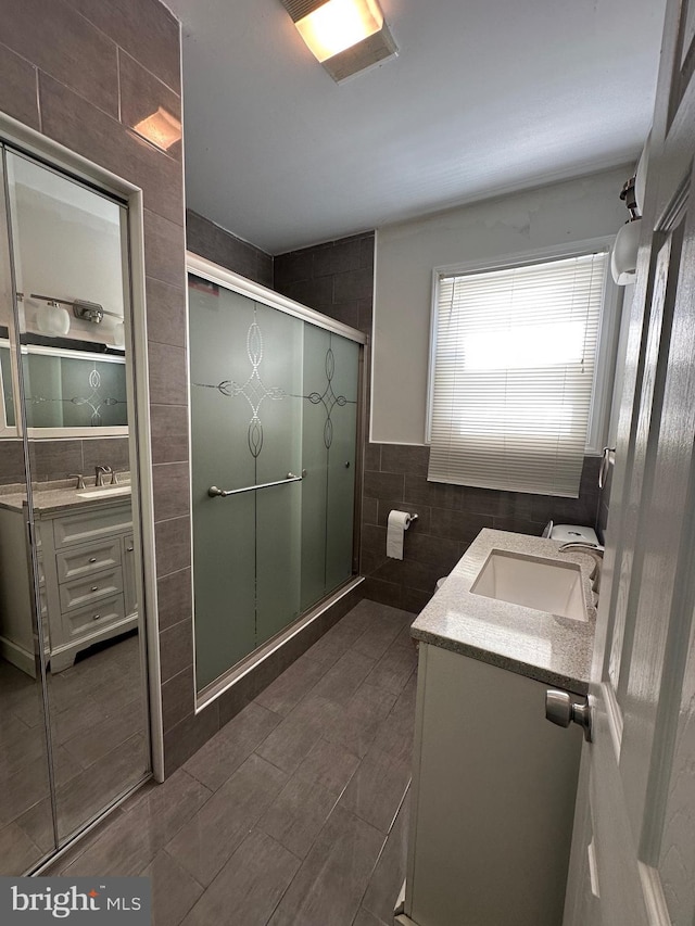 426 Parkwynne Rd, Lancaster, PA 17601 - bathroom with tile walls, vanity, and a stall shower