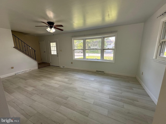 426 Parkwynne Rd, Lancaster, PA 17601 - unfurnished living room with a ceiling fan, stairway, and light wood-style floors