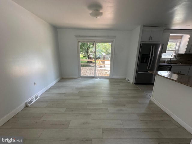 426 Parkwynne Rd, Lancaster, PA 17601 - unfurnished dining area with a sink, baseboards, and light wood finished floors