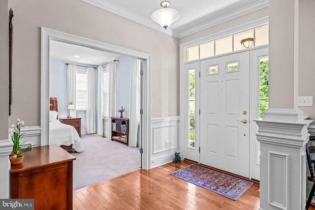 1165 Fulling Mill Ln, Haddon Heights, NJ 08035 - entryway with healthy amount of natural light, hardwood / wood-style floors, ornamental molding, and a wainscoted wall