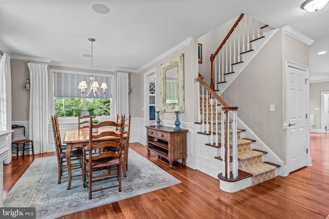 1165 Fulling Mill Ln, Haddon Heights, NJ 08035 - dining room with crown molding, stairs, wood finished floors, a chandelier, and a wainscoted wall