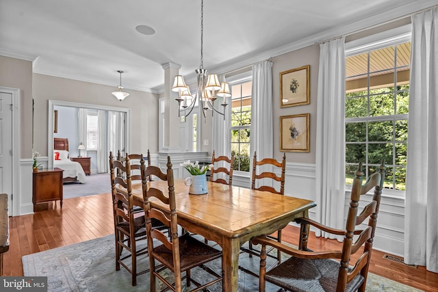 1165 Fulling Mill Ln, Haddon Heights, NJ 08035 - dining area featuring crown molding, wood-type flooring, a chandelier, a decorative wall, and a wainscoted wall