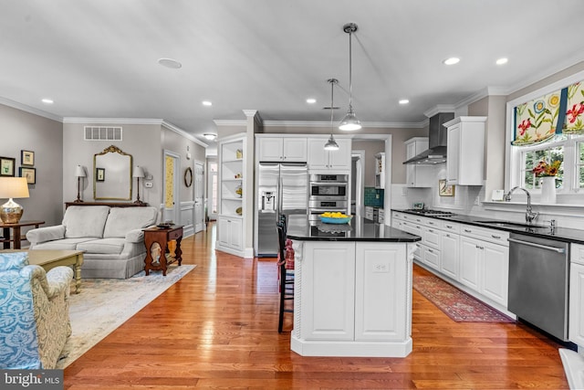 1165 Fulling Mill Ln, Haddon Heights, NJ 08035 - kitchen featuring appliances with stainless steel finishes, dark countertops, wall chimney range hood, white cabinets, and recessed lighting