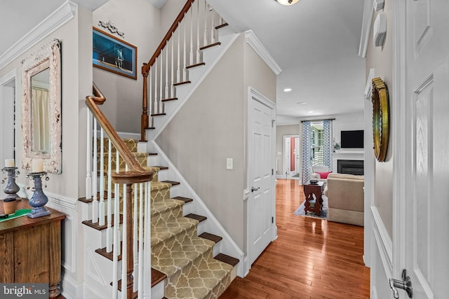 1165 Fulling Mill Ln, Haddon Heights, NJ 08035 - staircase featuring hardwood / wood-style floors, a fireplace, recessed lighting, and ornamental molding