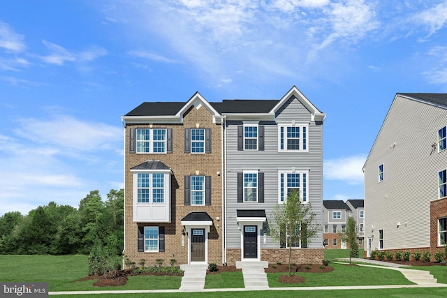 5412 Billenca Ln Unit B, Upper Marlboro, MD 20772 - view of front of house featuring a front yard and brick siding