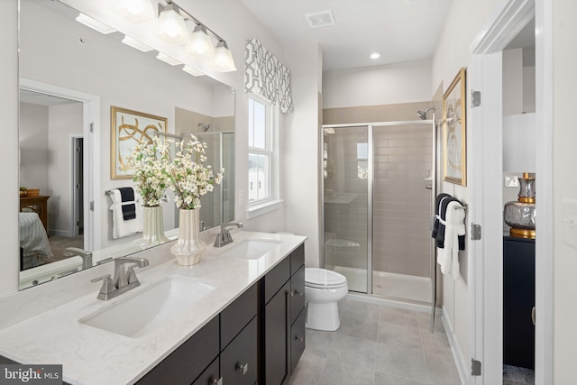 5412 Billenca Ln Unit B, Upper Marlboro, MD 20772 - ensuite bathroom featuring a shower stall, double vanity, toilet, tile patterned flooring, and recessed lighting