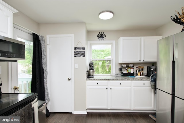 13732 Moccasin Ct, Woodbridge, VA 22193 - kitchen featuring stainless steel appliances, white cabinetry, dark wood-style floors, and light stone countertops