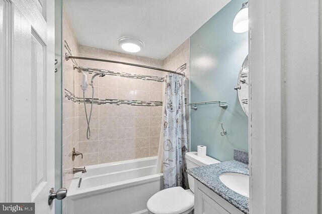 20429 Ambassador Ter Unit 20429, Germantown, MD 20874 - bathroom featuring shower / bath combination with curtain, vanity, and toilet