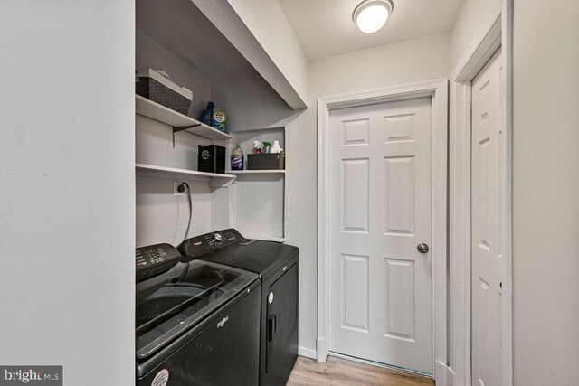 20429 Ambassador Ter Unit 20429, Germantown, MD 20874 - laundry area featuring independent washer and dryer and light wood-style flooring
