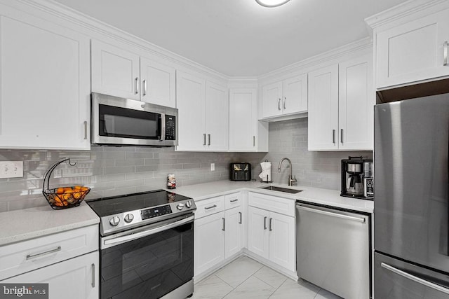 20429 Ambassador Ter Unit 20429, Germantown, MD 20874 - kitchen with stainless steel appliances, a sink, white cabinetry, light countertops, and light marble finish floors