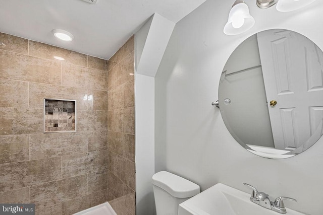 20429 Ambassador Ter Unit 20429, Germantown, MD 20874 - bathroom featuring toilet, a tile shower, and a sink