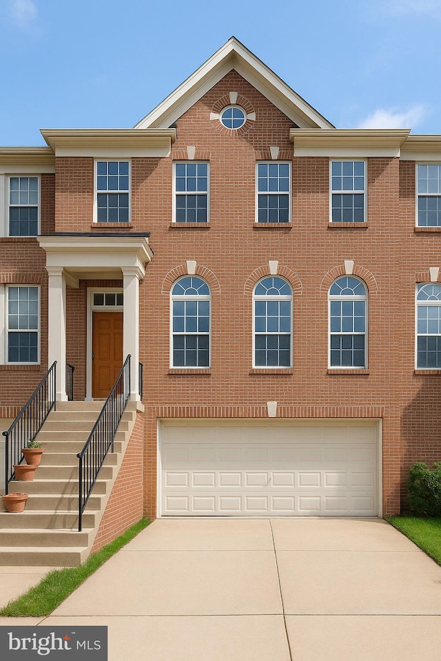 2642 Logan Wood Dr, Herndon, VA 20171 - multi unit property featuring an attached garage, driveway, and brick siding