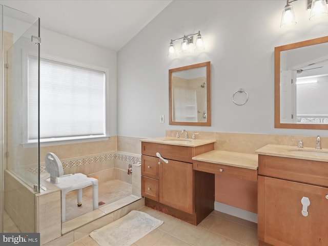2642 Logan Wood Dr, Herndon, VA 20171 - full bath featuring vaulted ceiling, tile patterned flooring, double vanity, a shower, and a tub