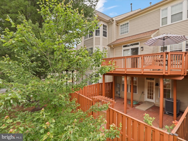 2642 Logan Wood Dr, Herndon, VA 20171 - rear view of house featuring central AC, a wooden deck, and a patio area