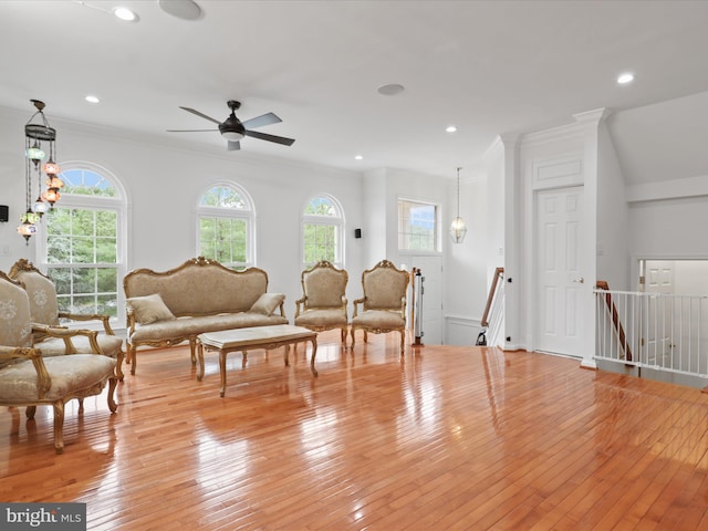 2642 Logan Wood Dr, Herndon, VA 20171 - living area with healthy amount of natural light, light wood finished floors, ornamental molding, ceiling fan, and recessed lighting