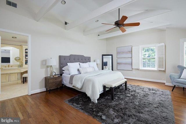 5403 Center St, Chevy Chase, MD 20815 - bedroom with wood finished floors, baseboards, connected bathroom, and a ceiling fan
