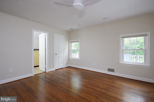 5403 Center St, Chevy Chase, MD 20815 - unfurnished bedroom with baseboards, wood finished floors, ensuite bath, and ceiling fan