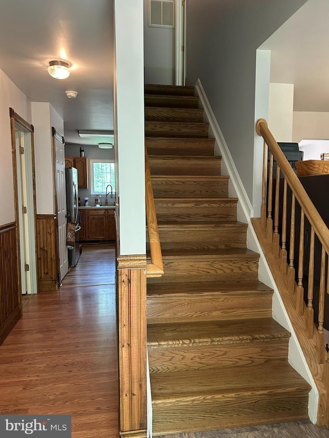 76 Red Burke Ct, Front Royal, VA 22630 - stairs with wood finished floors and wainscoting