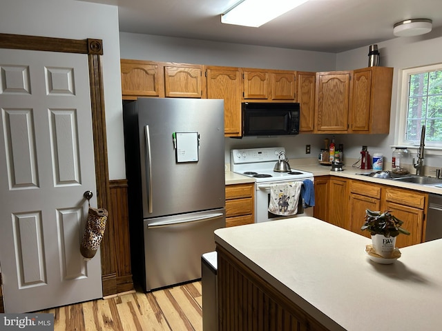 76 Red Burke Ct, Front Royal, VA 22630 - kitchen featuring black microwave, freestanding refrigerator, electric range, light countertops, and light wood-type flooring