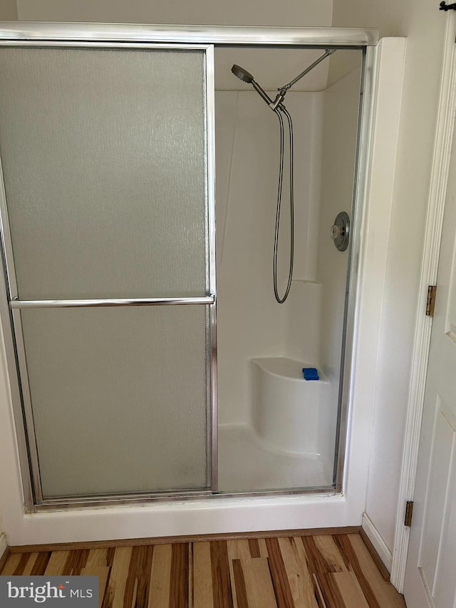 76 Red Burke Ct, Front Royal, VA 22630 - full bathroom featuring wood finished floors and a stall shower