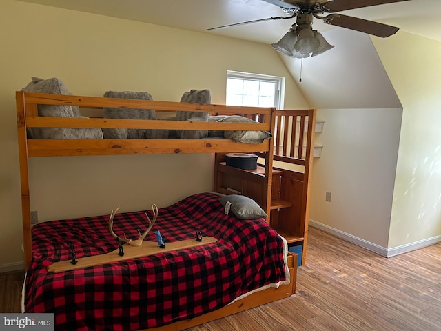 76 Red Burke Ct, Front Royal, VA 22630 - bedroom featuring wood finished floors, vaulted ceiling, and a ceiling fan