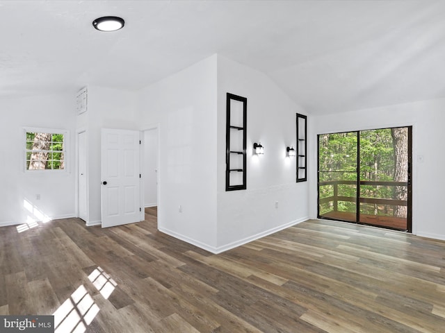 153 Bear Track Rd, Augusta, WV 26704 - unfurnished living room with vaulted ceiling, wood finished floors, and baseboards