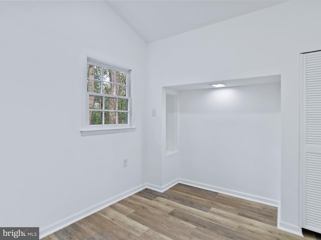 153 Bear Track Rd, Augusta, WV 26704 - spare room with lofted ceiling, wood finished floors, and baseboards