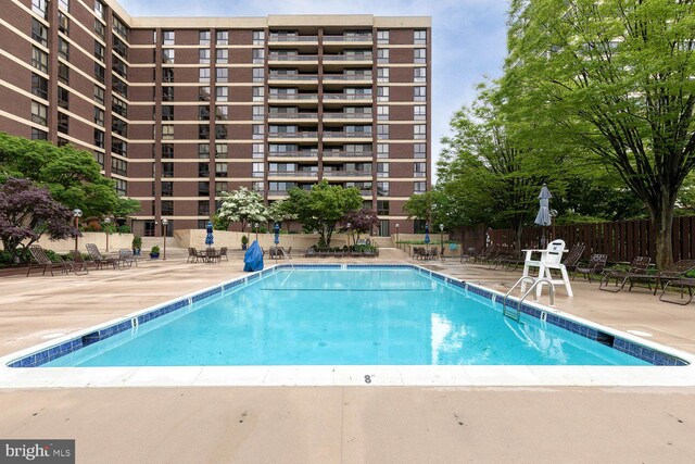 4100 N Charles St Unit 203, Baltimore, MD 21218 - community pool featuring a patio