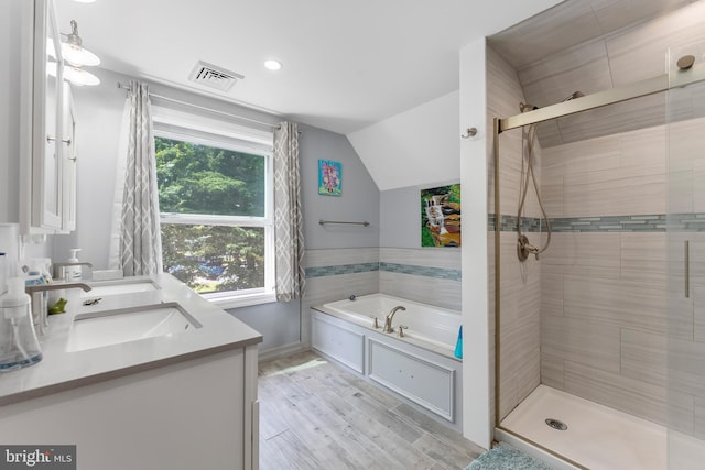 25 N 12th St, Del Haven, NJ 08251 - full bath featuring a shower stall, a bath, vanity, vaulted ceiling, and wood finished floors