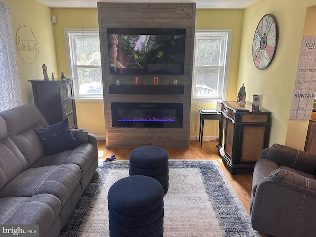 25 N 12th St, Del Haven, NJ 08251 - living room featuring wood finished floors, a large fireplace, and baseboards