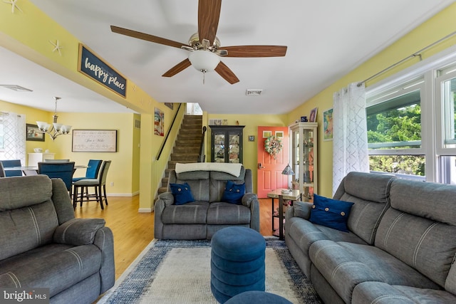 25 N 12th St, Del Haven, NJ 08251 - living area featuring wood finished floors, healthy amount of natural light, a chandelier, and stairs