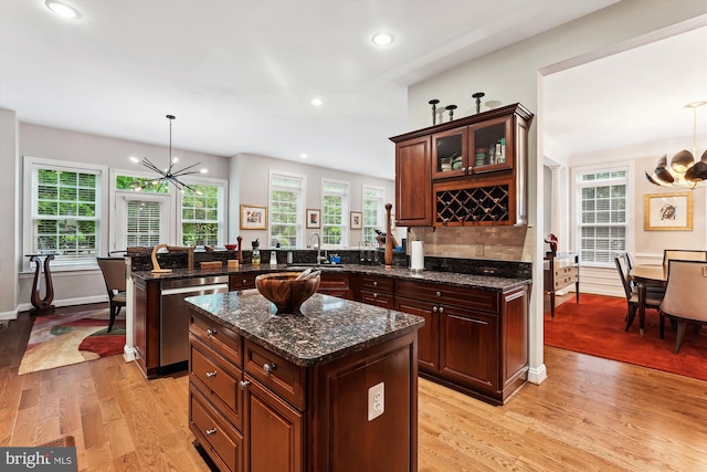 47666 Paulsen Sq, Potomac Falls, VA 20165 - kitchen with a chandelier, a peninsula, dishwasher, light wood-type flooring, and recessed lighting