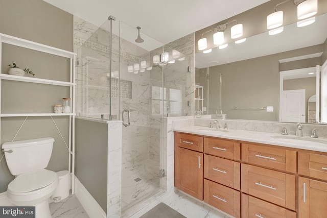 539 Shepherd St NW, Washington, DC 20011 - bathroom with marble look tiles, double vanity, toilet, and a marble finish shower