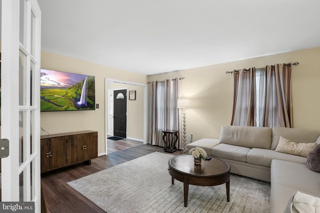 6 E Saxony Dr, New Castle, DE 19720 - living room featuring dark wood-style floors and baseboards