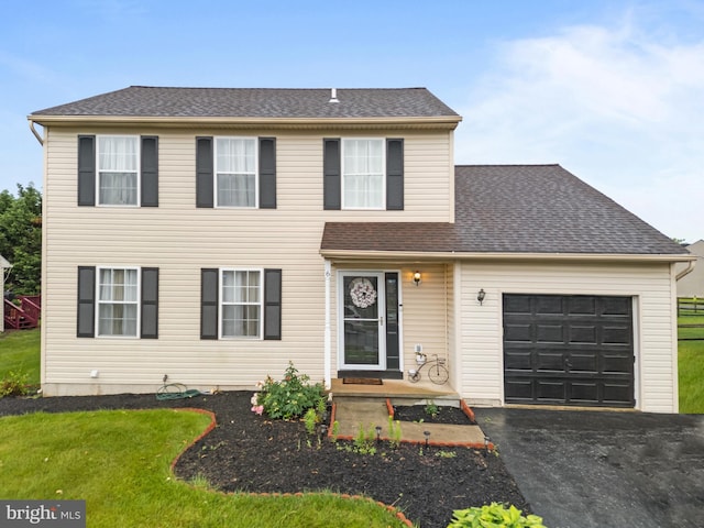 6 E Saxony Dr, New Castle, DE 19720 - view of front of property featuring a garage, driveway, a front lawn, and roof with shingles