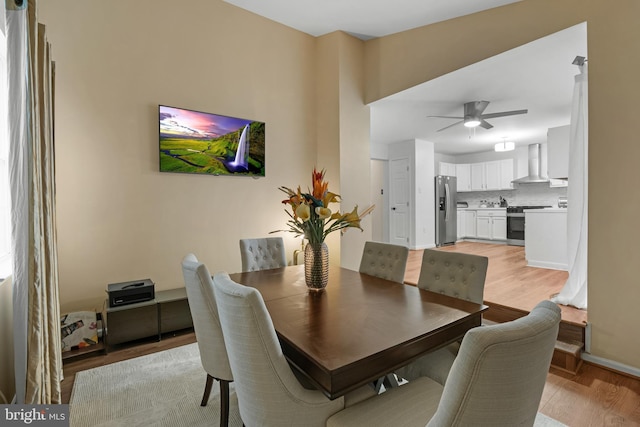 6 E Saxony Dr, New Castle, DE 19720 - dining room with light wood-style flooring, ceiling fan, and baseboards