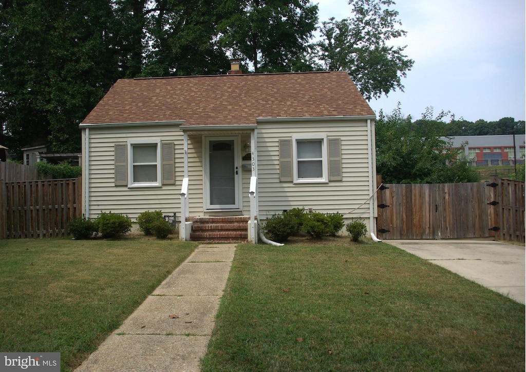 4303 Fernhill Rd, Silver Spring, MD 20906 - bungalow-style house featuring entry steps, roof with shingles, a chimney, and a gate