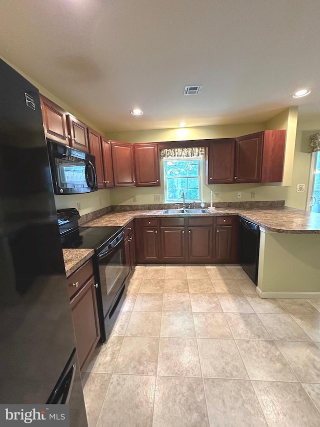 413 Park View Dr, Harrisburg, PA 17110 - kitchen featuring black appliances, recessed lighting, light tile patterned floors, a sink, and stone countertops