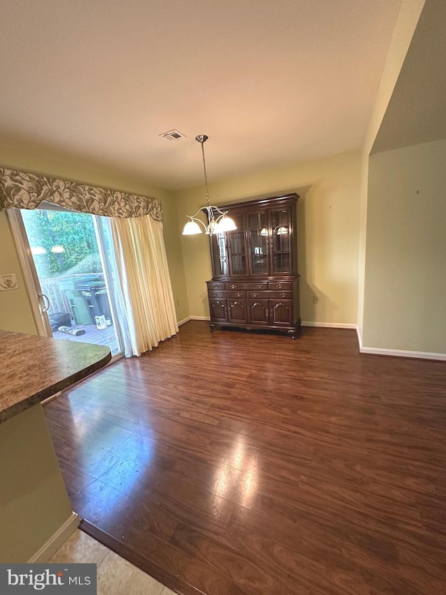 413 Park View Dr, Harrisburg, PA 17110 - unfurnished dining area featuring dark wood-type flooring and baseboards