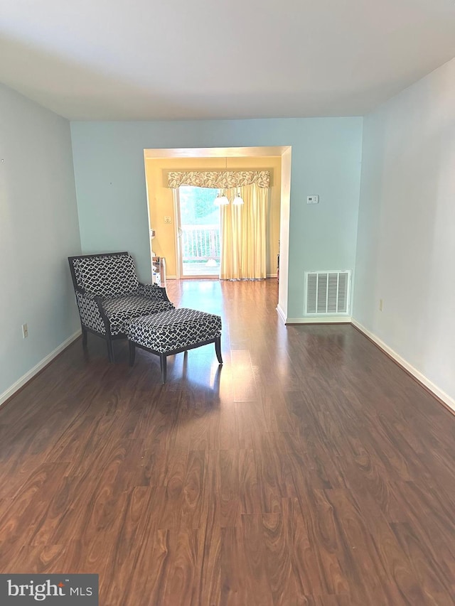 413 Park View Dr, Harrisburg, PA 17110 - living area with a chandelier, dark wood-type flooring, and baseboards